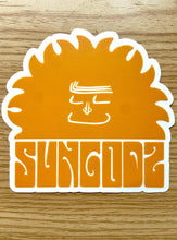 Load image into Gallery viewer, Orange Sungodz Siesta Sun 4x4&quot;inch clear back sticker.
