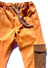Load image into Gallery viewer, Sungodz&#39;23 Cruiser Jam Pant in Tangerine with Driftwood Brown Pockets.
